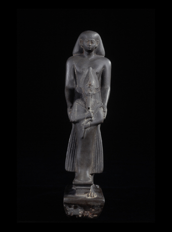 Statue of a man presenting an effigy of Osiris