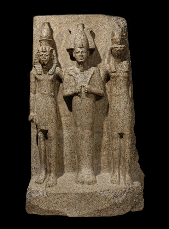 Sculpted group of Osiris flanked by his son Horus and a king
